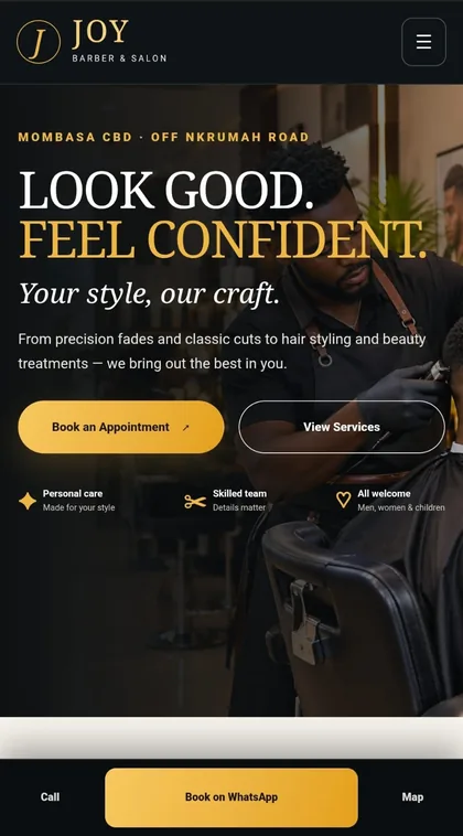 Joy Barber and Salon homepage on a phone